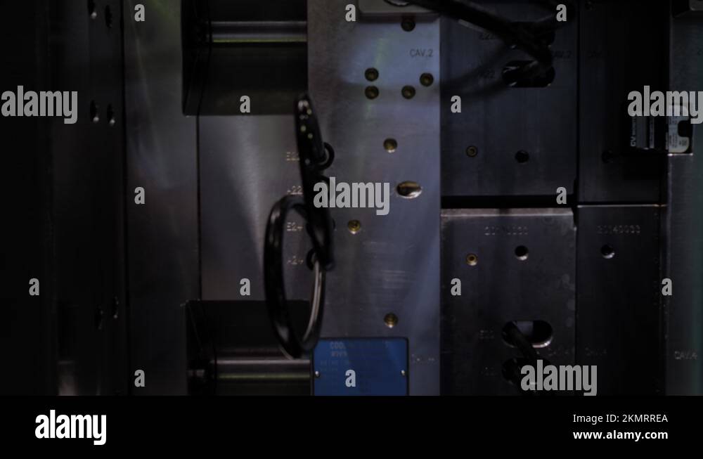 Production of empty plastic cups - injection molding machine during ...