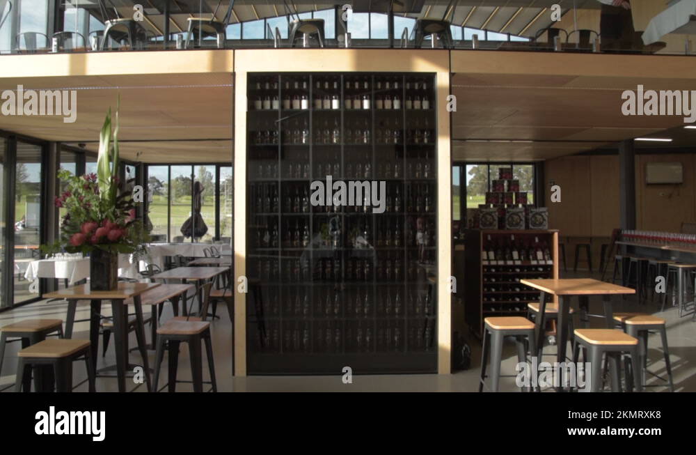 Modern looking interior of restaurant with huge shelves of wines, dolly