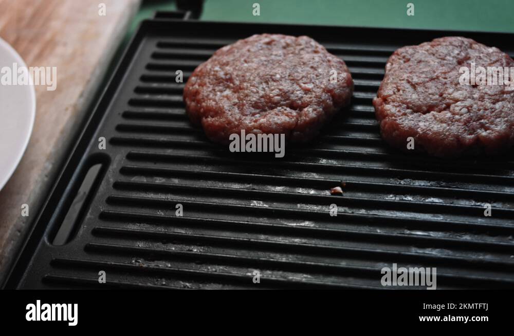 Fry the beef patties on the grill. Taste Classic American burger. 4k