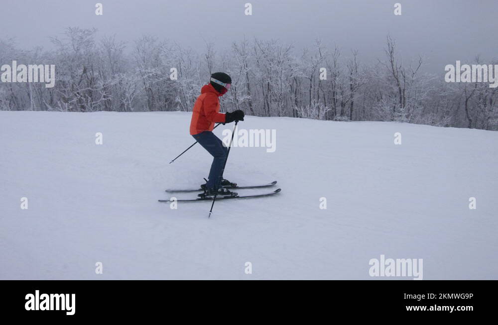Women downhill skiing on snowy mountain slope Stock Videos & Footage