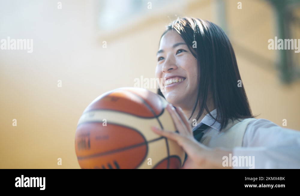 gymnasium-high-school-girl-who-passes-with-basketball-at-the-gymnasium