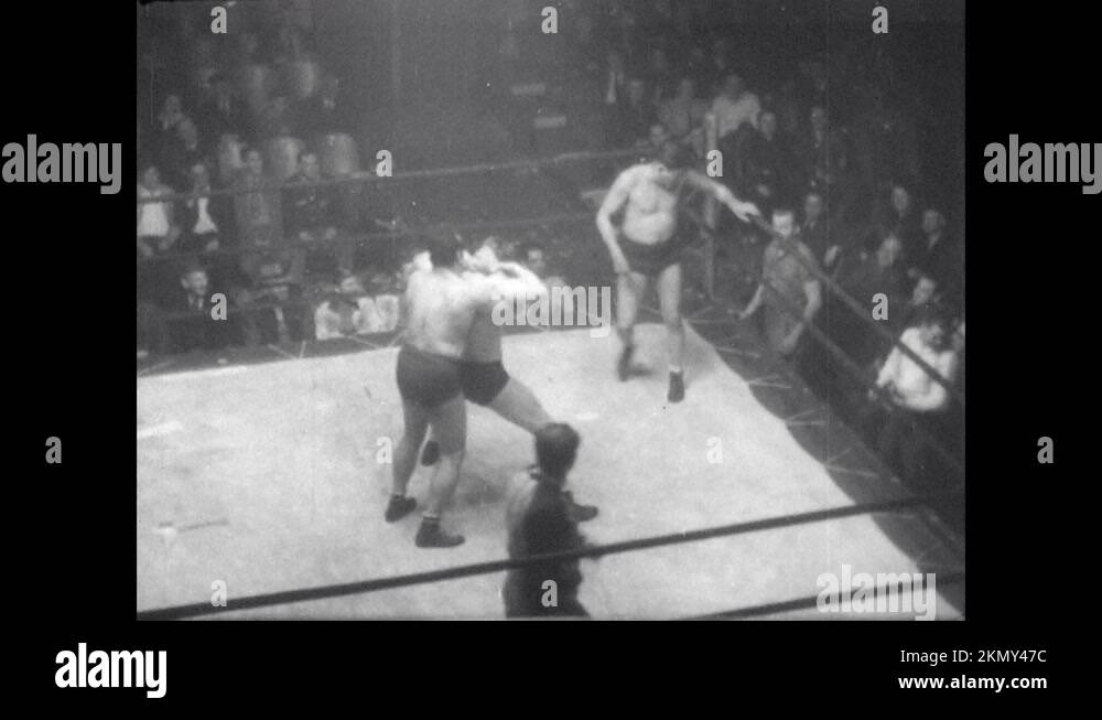 1940s Wrestler slaps and punches opponents. Wrestlers punch and brawl