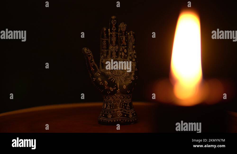 Fortune teller hand or palmistry on the witch table. Palmistry with