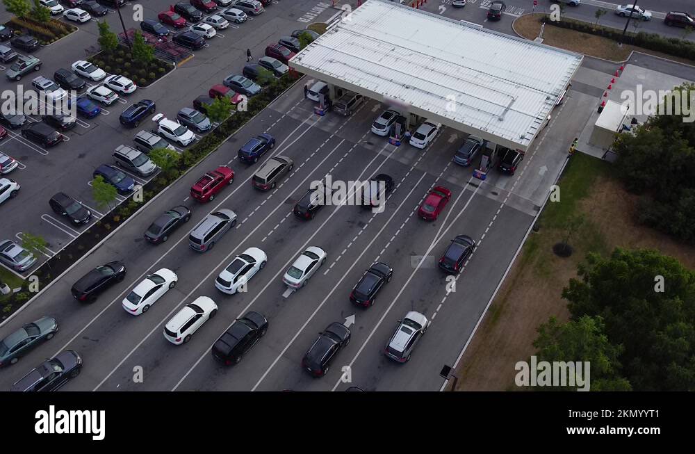 Busy gas station with cars lined up in queue during pandemic gasoline fuel Stock Video Footage