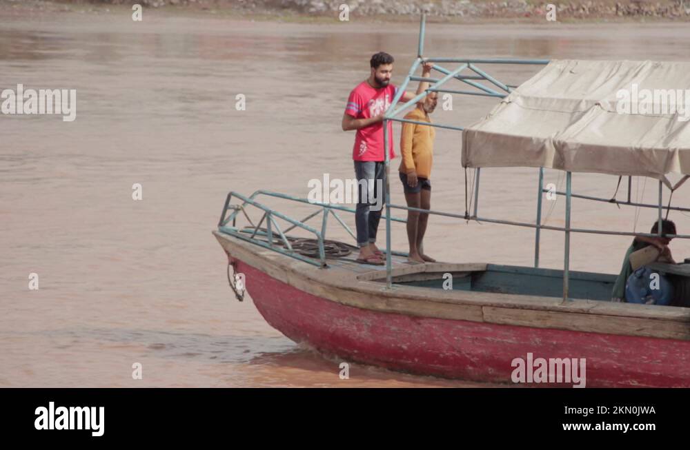 The Ravi Slum Village People Ride A Boat On Pakistans River Ravi, Slums On The ...