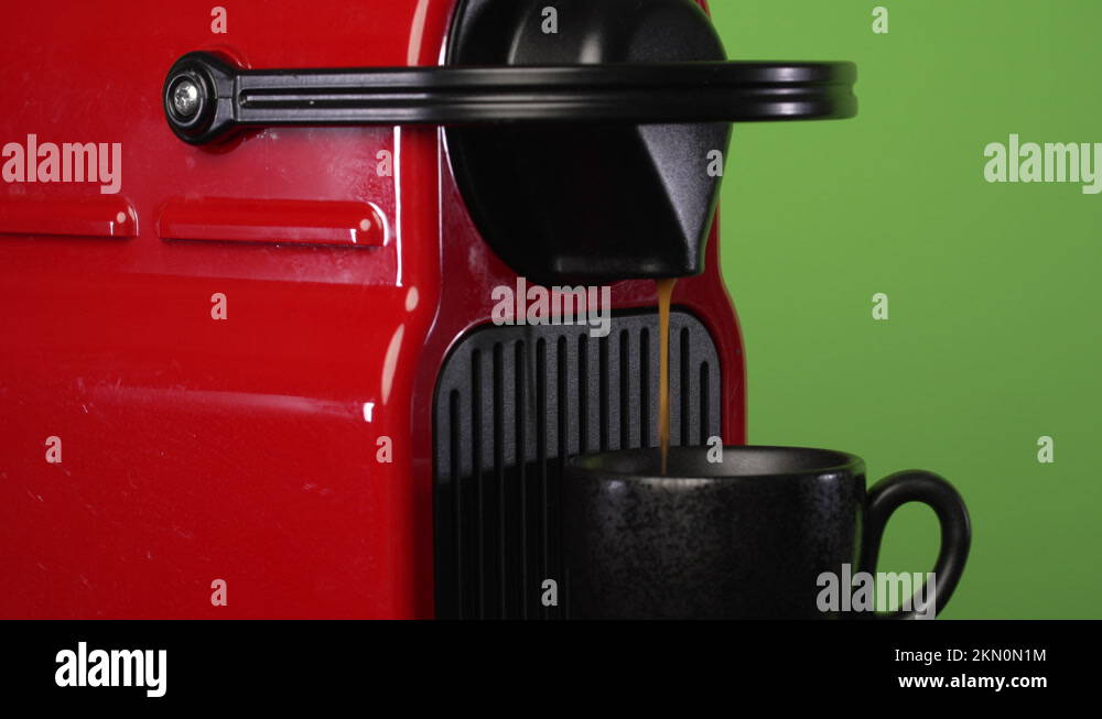 Nespresso Machine making coffee in front of chroma green screen Stock Video Footage Alamy