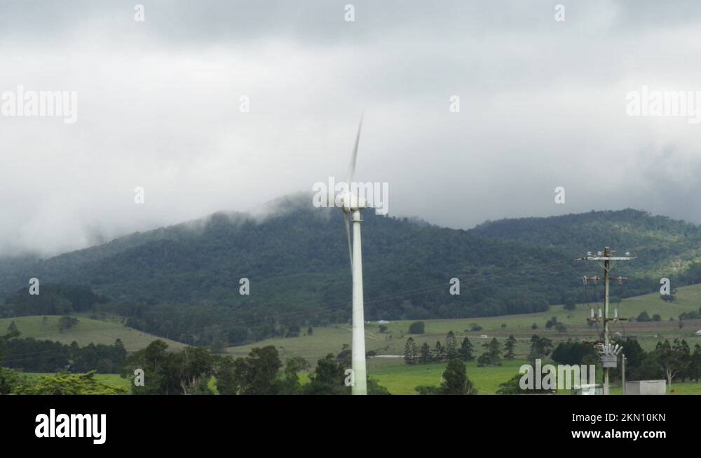 Wind turbine with hill valley in a foggy cloudy weather at Queensland