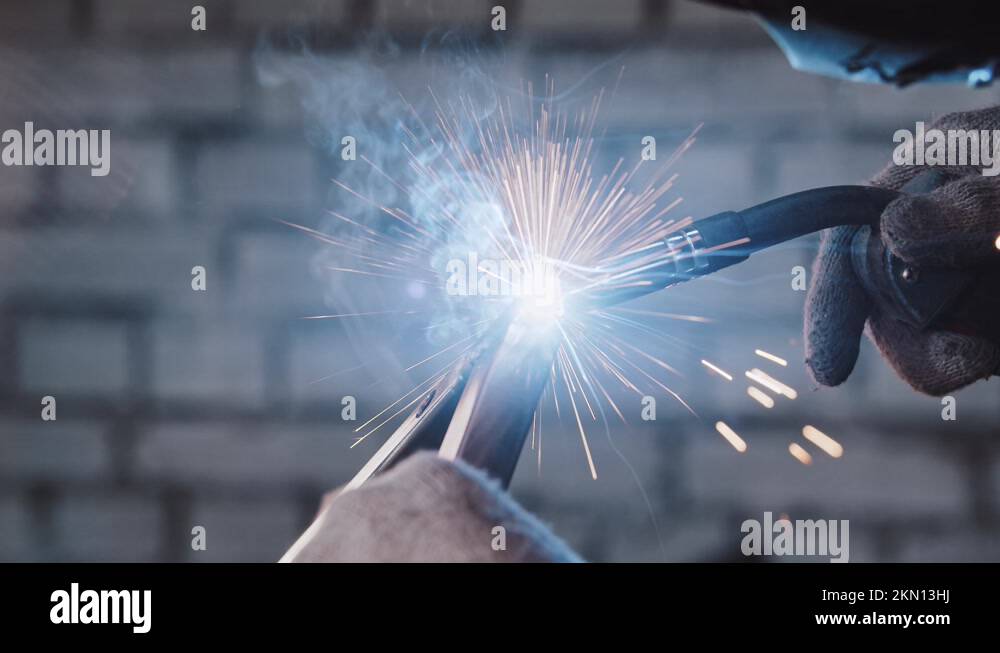 Process of welding two parts of the detail together blue glow and