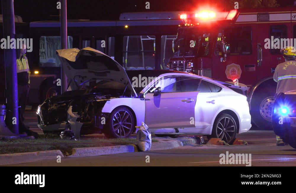 Car accident and crash at night in city intersection with emergency