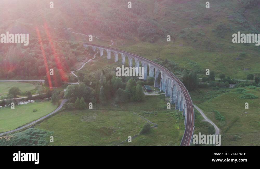 Drone Panning Above Glenfinnan Viaduct Scenic Railway Track With Large