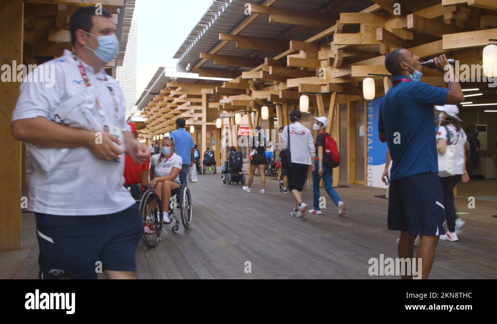 Athletes walking around at the entrance of the Tokyo 2020 Olympic and ...