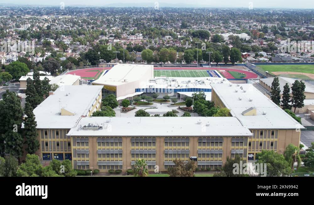 Exterior of Crenshaw High School, football field and city of South
