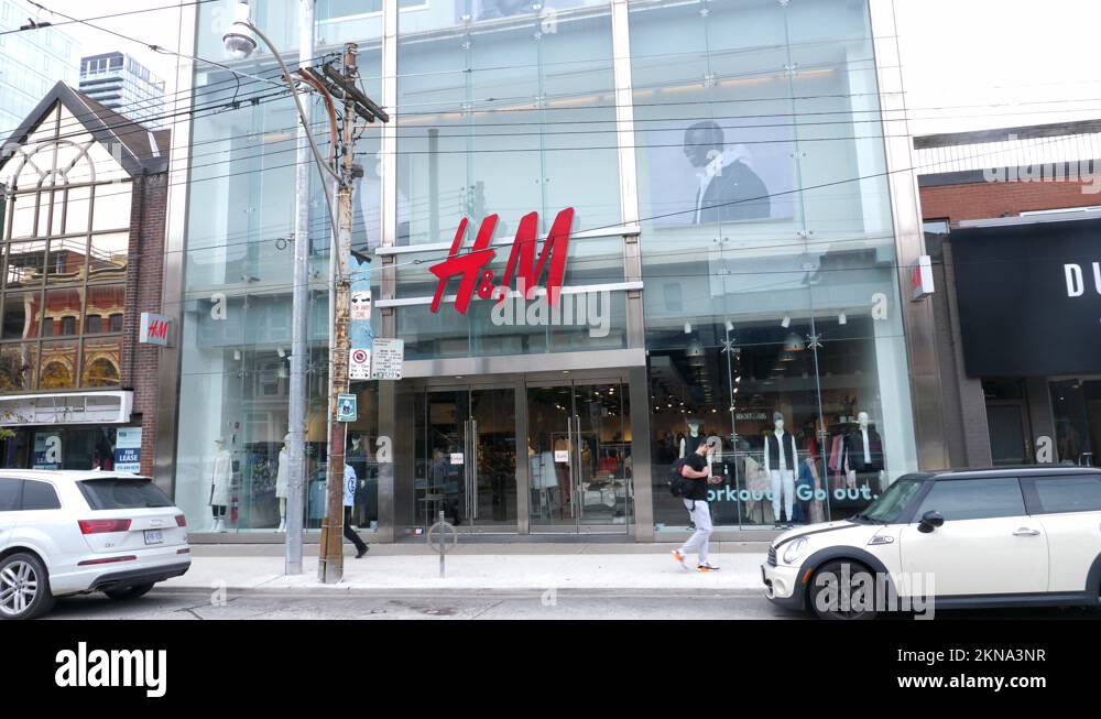 H&M fashion retail store on Queen Street in Toronto, Canada Stock Video