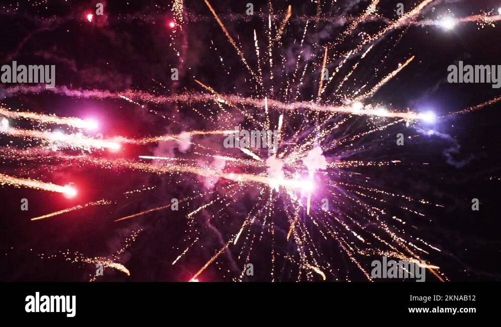 Fireworks explode sending sparks in every direction with different
