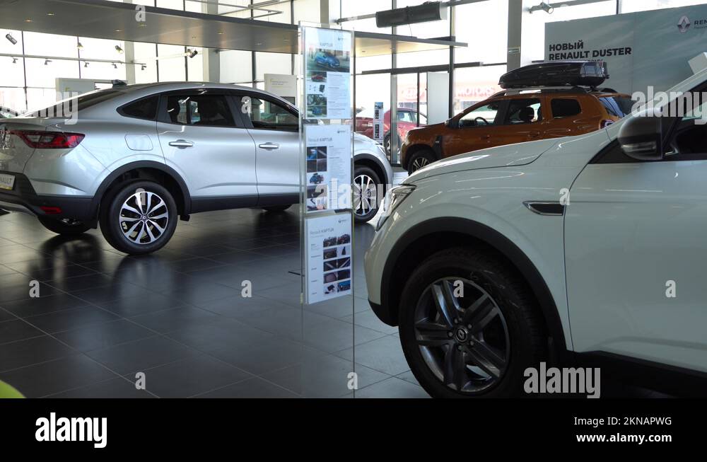 Renault Duster SUV in gold color with roof rack at Renault showroom