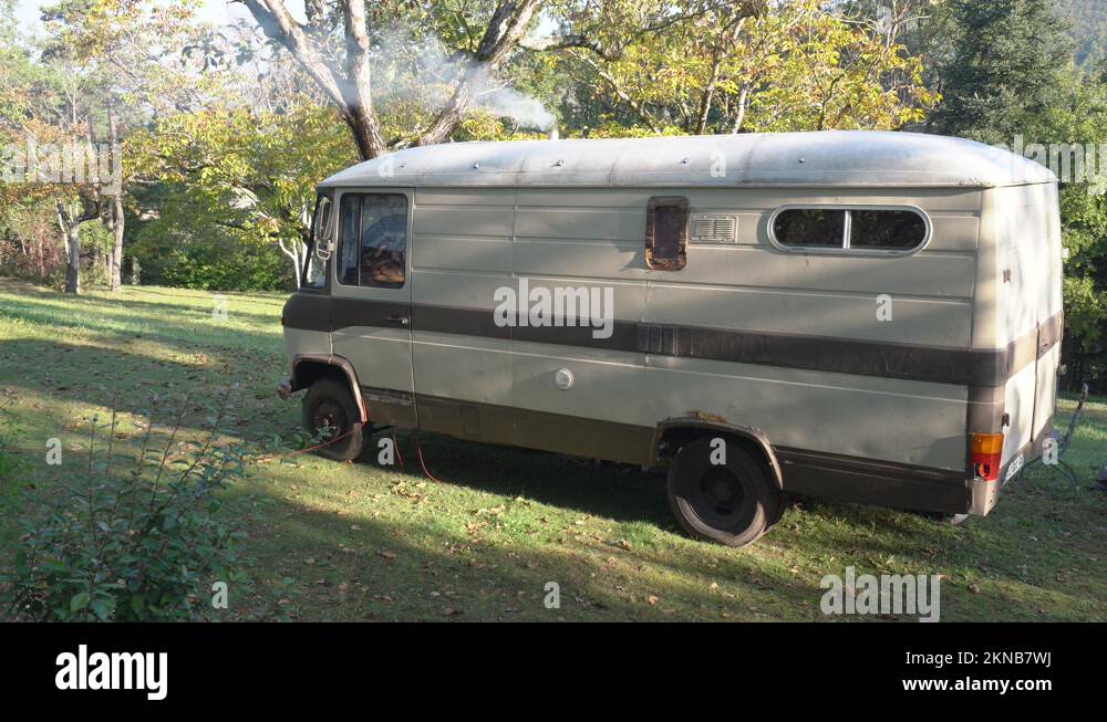 Vintage Motorhome, Smoke Rising From Stove Chimney Of Camper Van