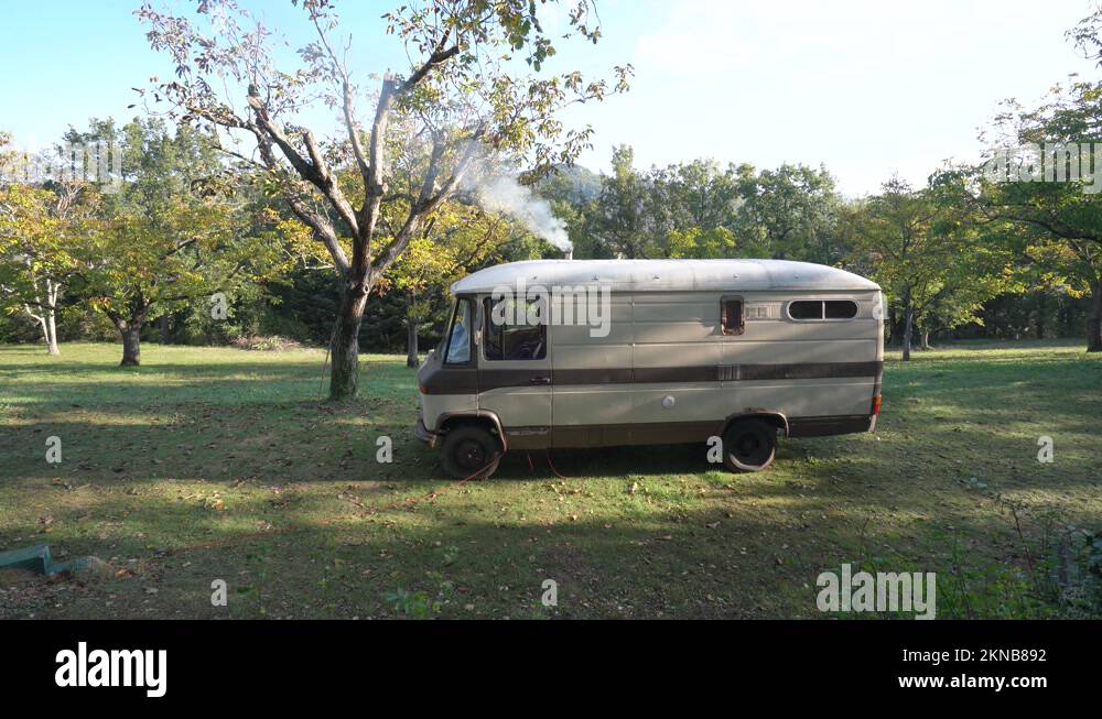Smoke Coming Out From Chimney Of Motorhome, Camper Van Parked In The
