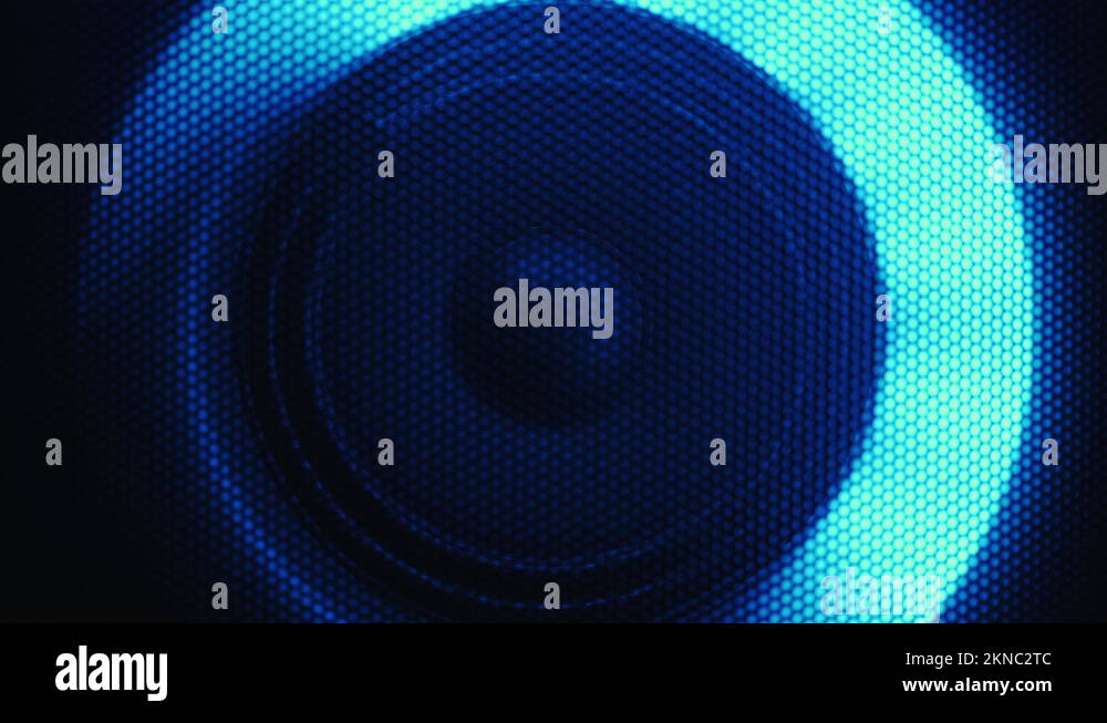 Front close up of modern sound speaker illuminated by neon flashing