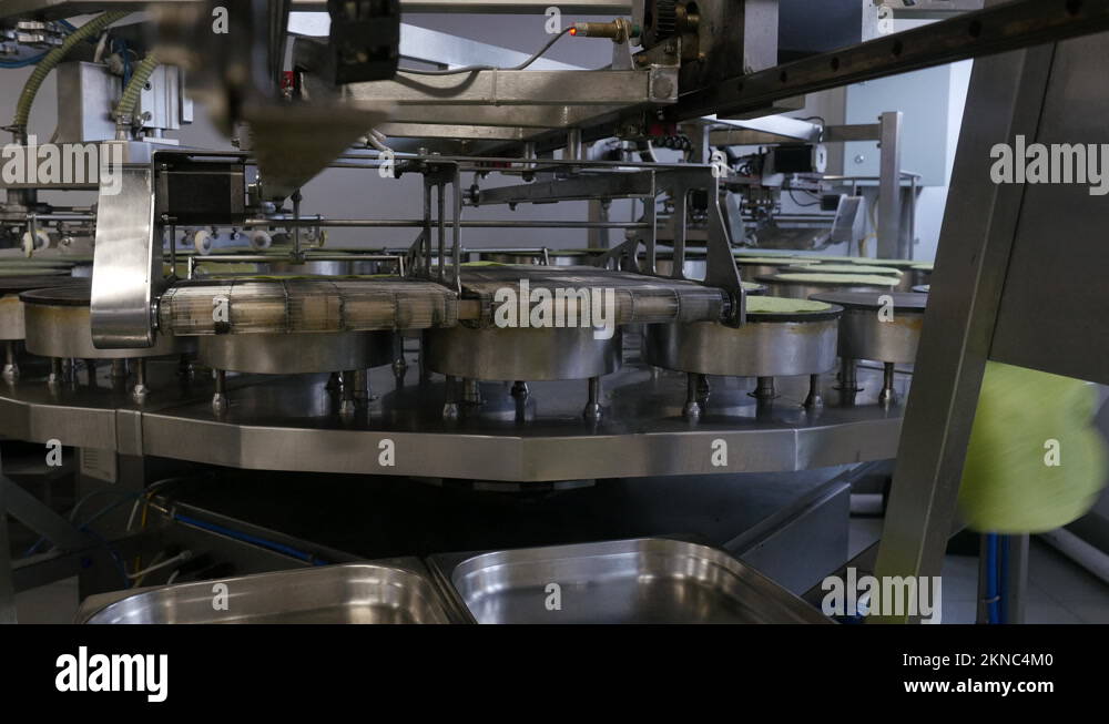 Automated pancake making process at a readymade food factory Stock