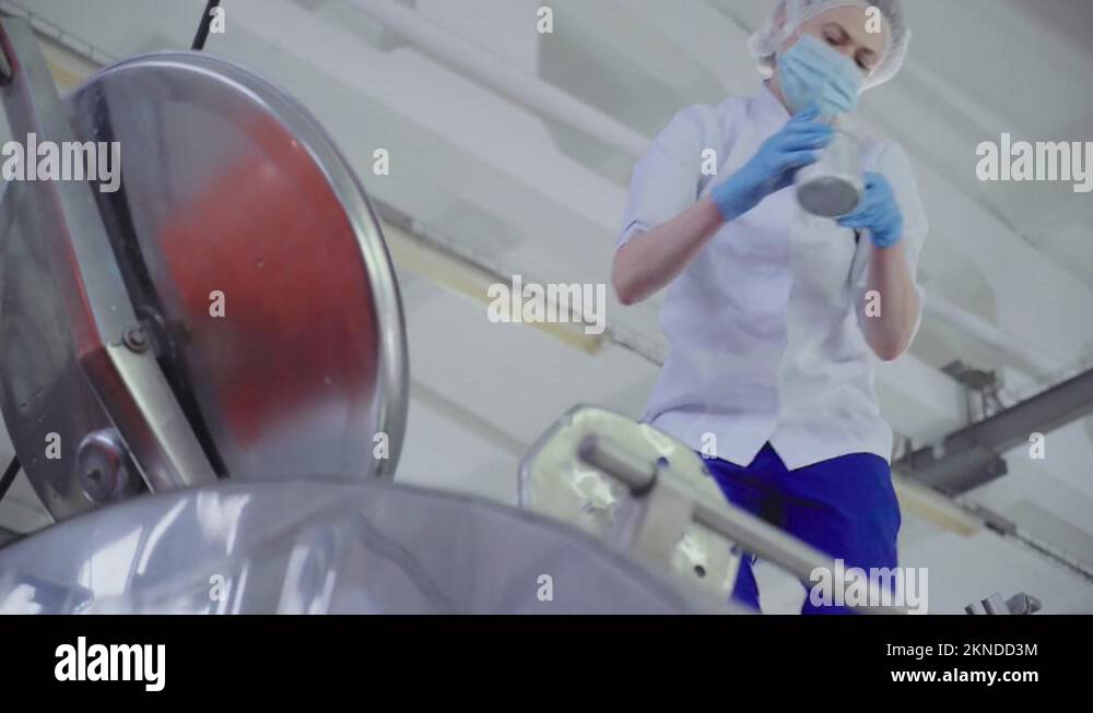 Dairy Food Production Factory Worker Takes Milk Sample For Laboratory