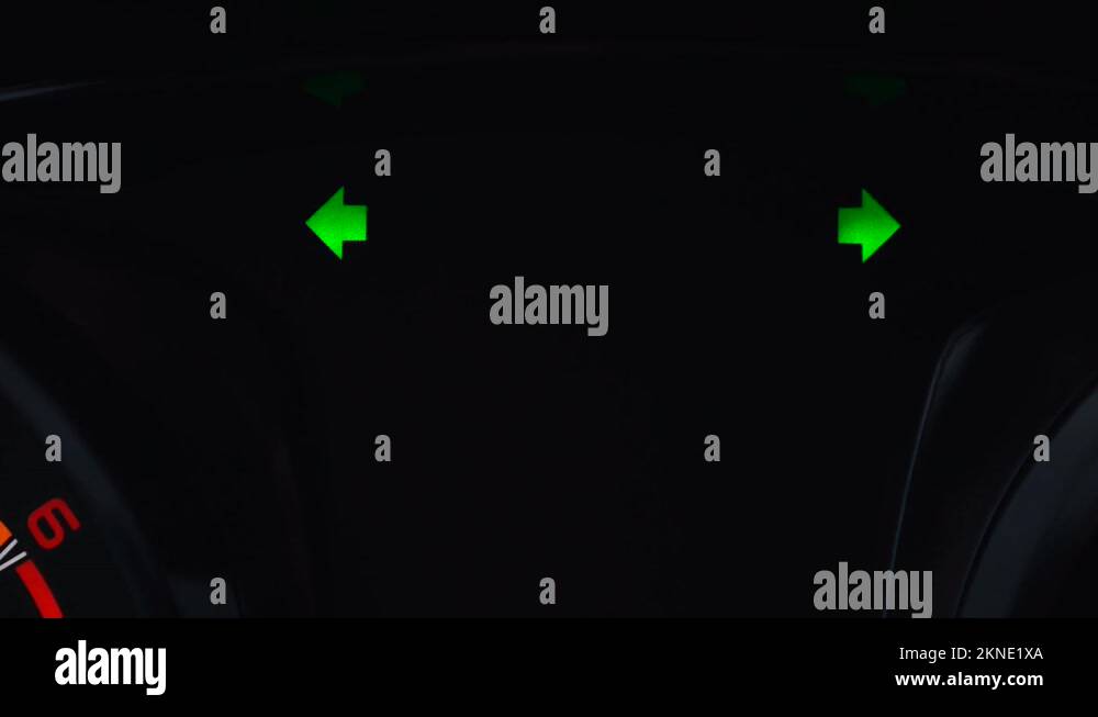 Flashing emergency warning light on the dashboard in a car with