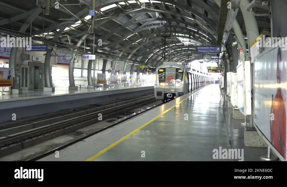 Metro passenger trains passing through at Delhi Metro station, Delhi, India Stock Video Footage