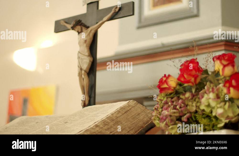 Altar of a church with decoration, bible and jesus figure Stock Video