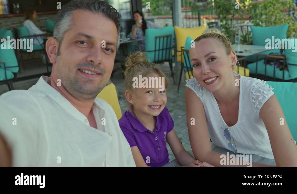Happy family using phone for video call. Front camera view Stock Video Footage Alamy