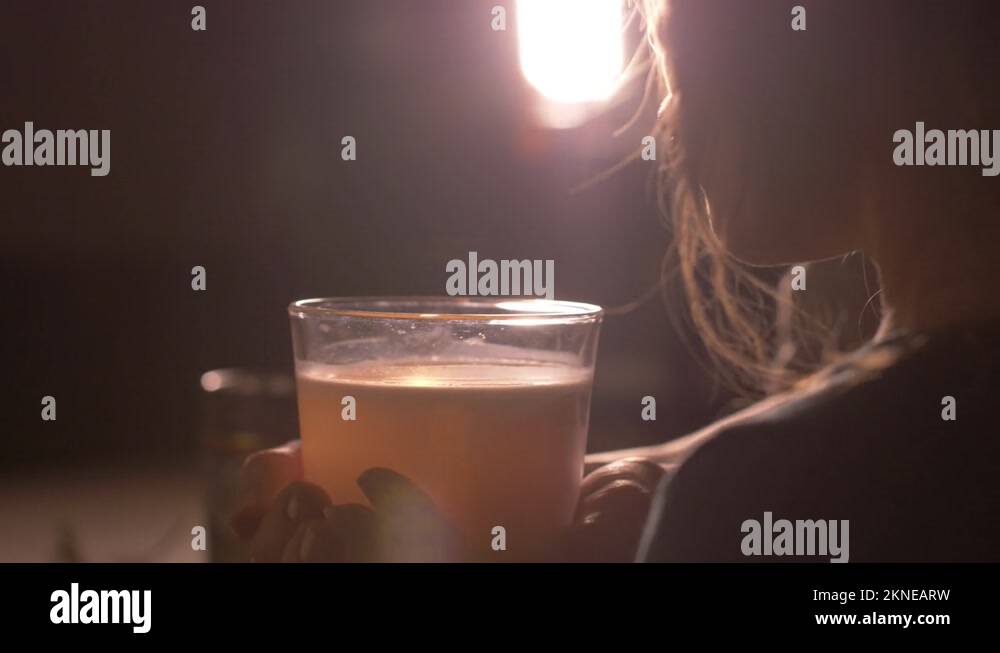 Little girl child blowing scented candle out, smoke coming out. Close