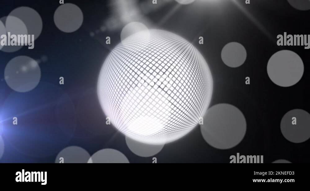 Animation of mirrorball and white bokeh lights on dark background Stock