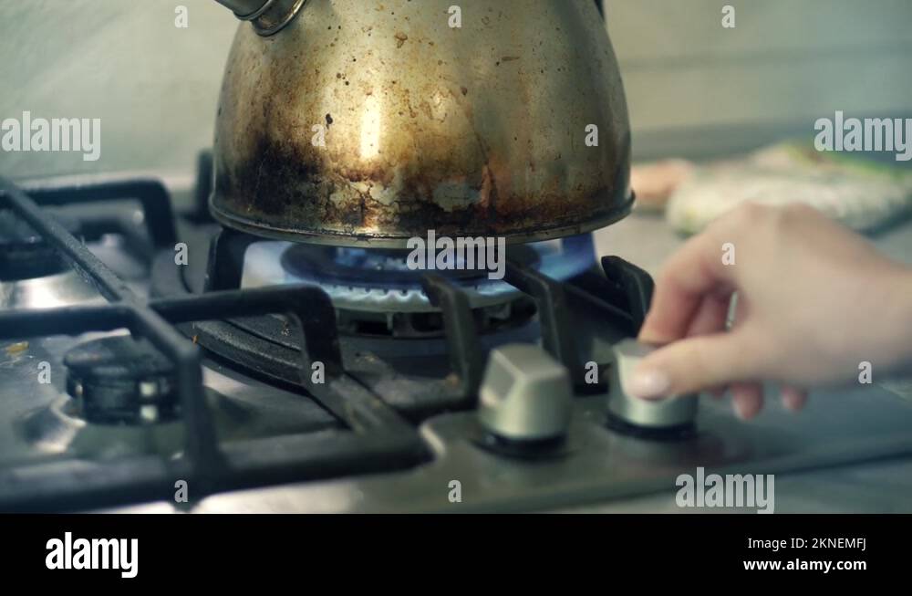 Hand Turn Gas Stove . Kettle In Kitchen. Steel Kettle On Gas Stove