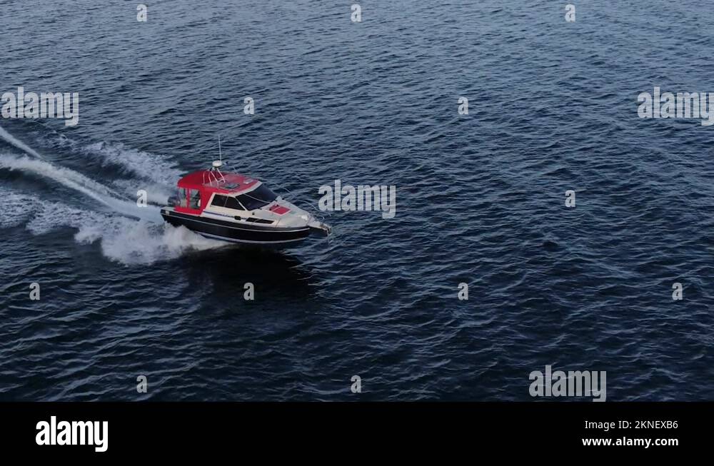 Unmanned Boat View Of Blue Clear Waters. Top View Of A White Boat Stock 