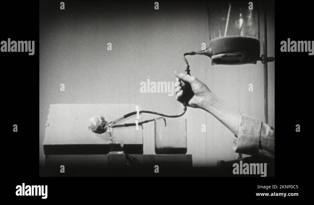 1940s Person uses hand to pump liquid through replica model of urine