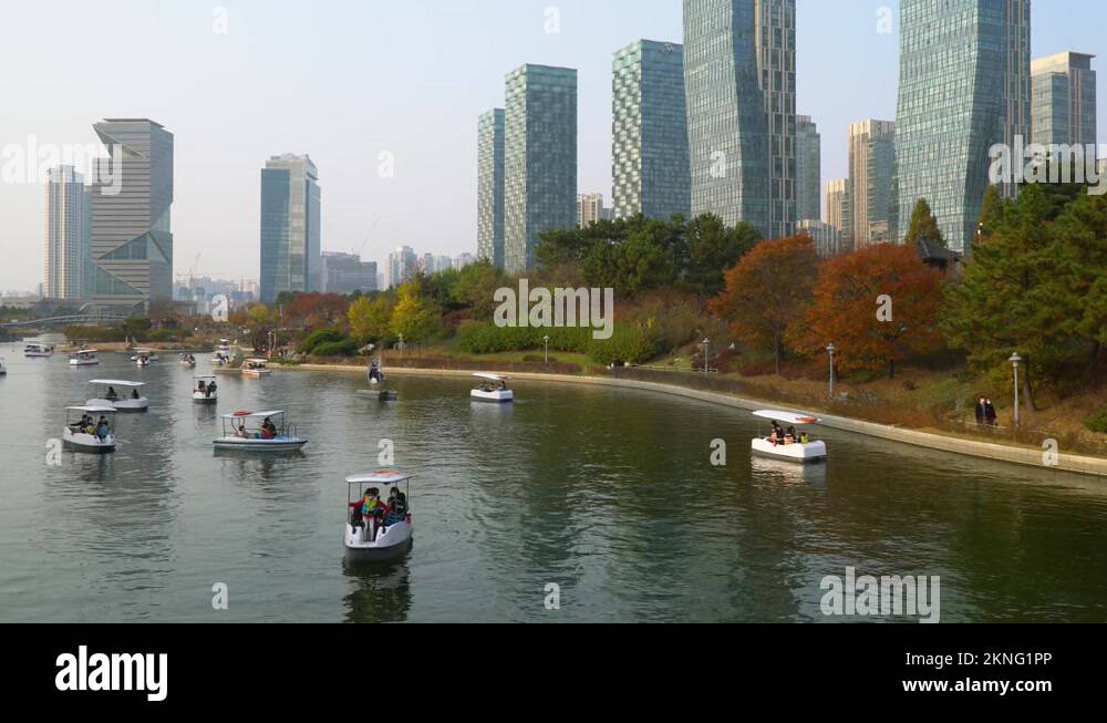 Korean Families ride paddle boats in Songdo Central Park in Incheon at