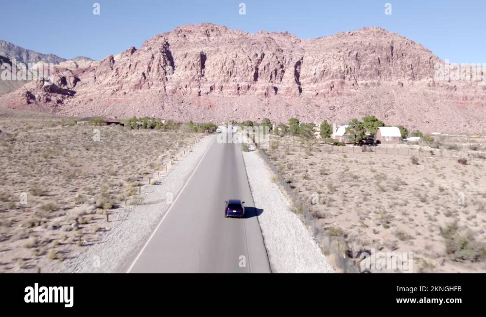 Drone shot tracking a car driving through Red Rock Canyon in Nevada Stock Video Footage Alamy