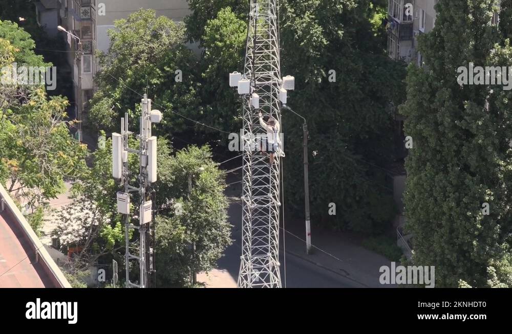 Mountaineer construction worker descends from top Stock Video Footage