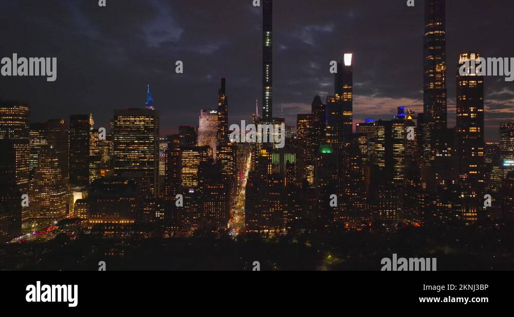Night city scene. High rise buildings and downtown skyscrapers against ...