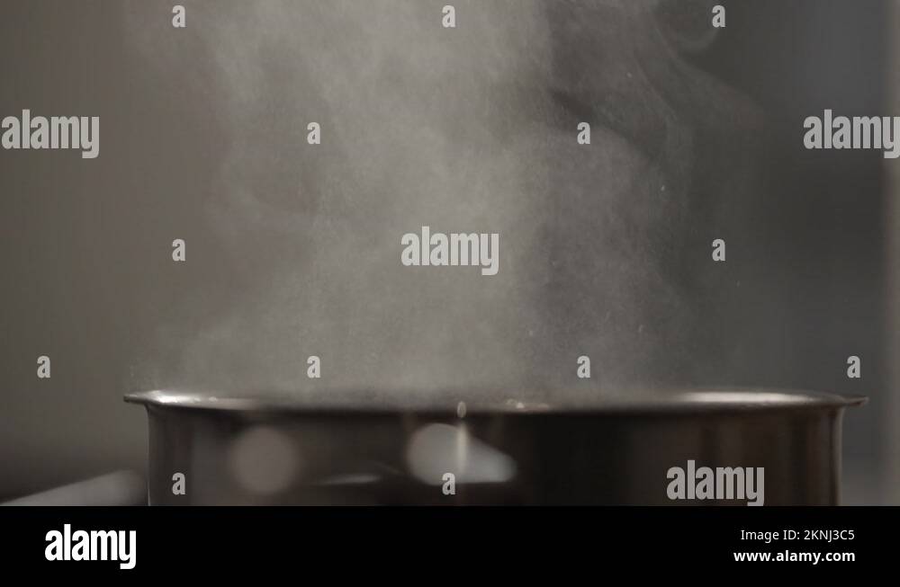 Boiling water on electric induction stove cooker Stock Videos & Footage