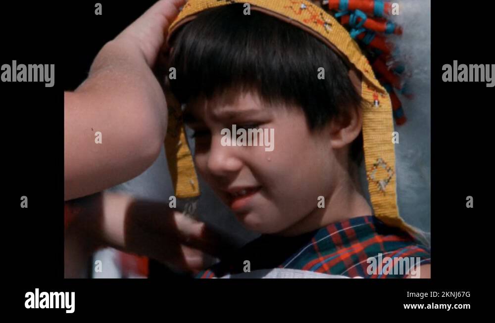 1950s Little girl with short hair has tear on her cheek, boy places