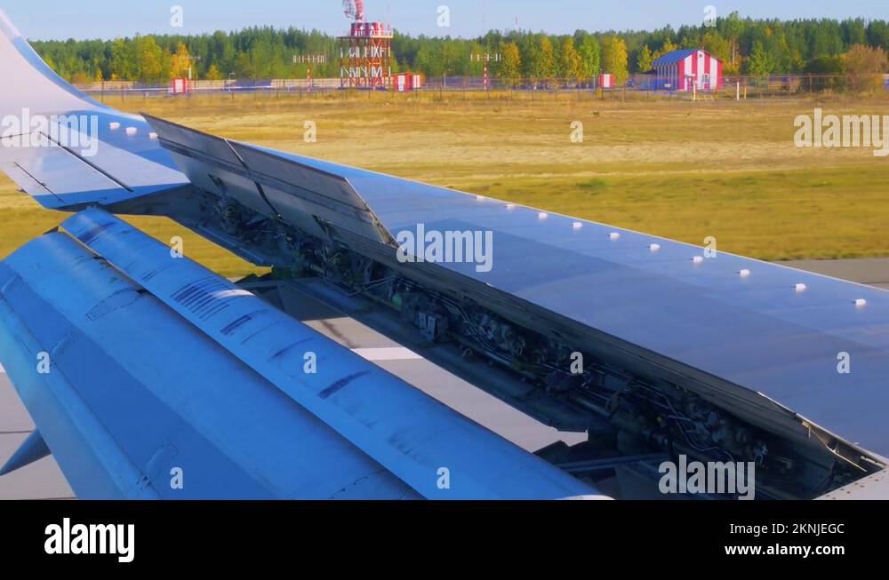 Airplane wing with open hydraulics in aileron position, landing