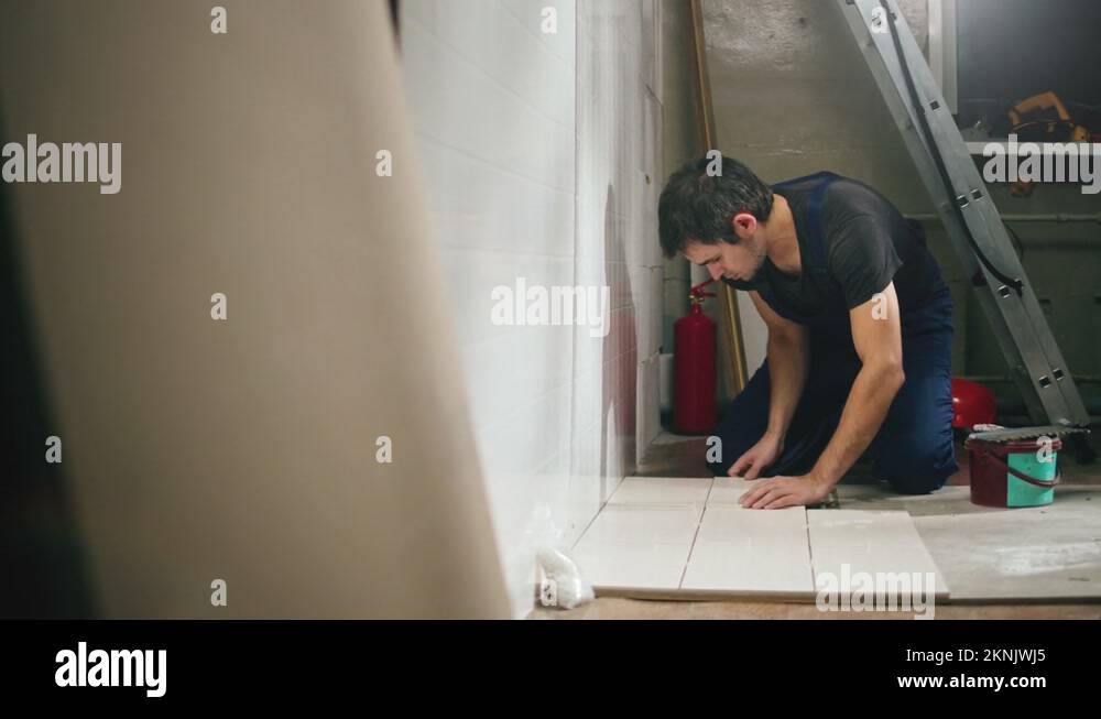 Tile Contractor Contractor installing ceramic tiles Stock Videos & Footage - HD and 4K ...