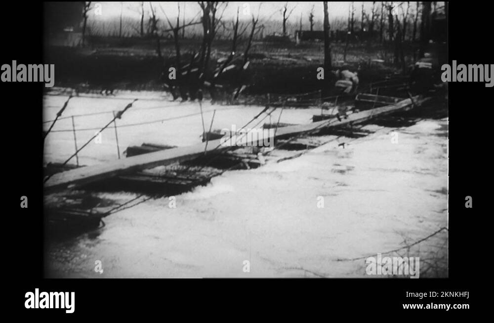 1940s Soldier runs across floating bridge. Soldiers walk through