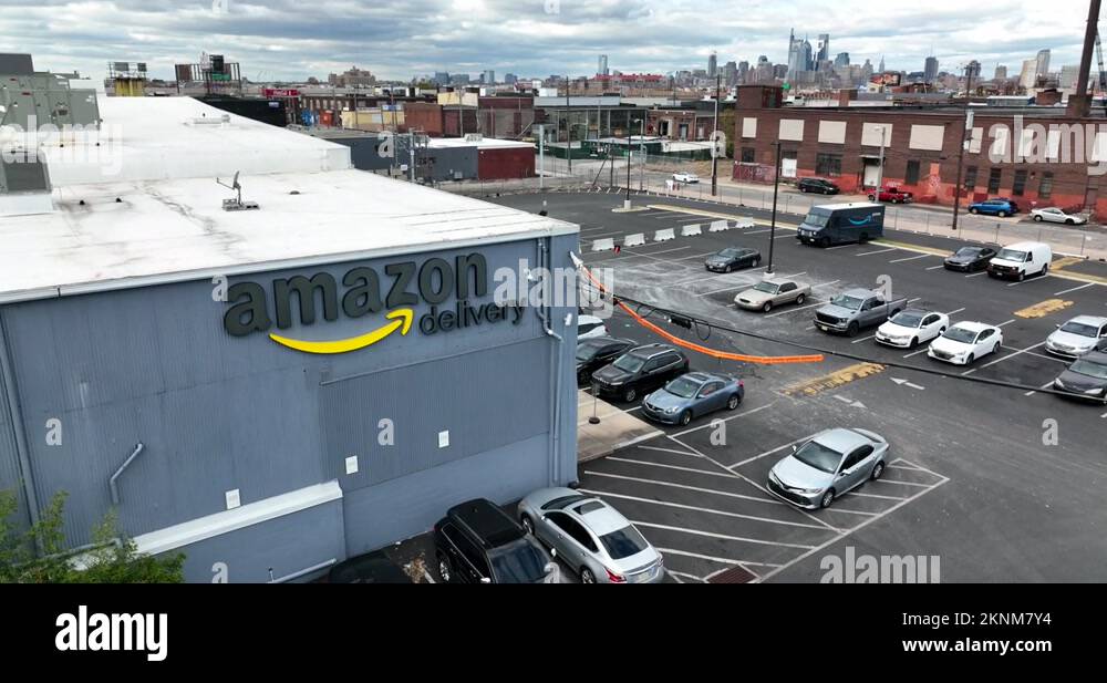 Amazon Delivery warehouse hub building. Rising aerial reveals