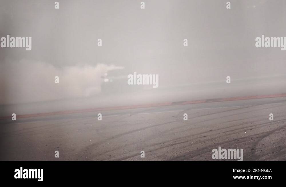 Race drift car burning tires on motorsport track. Footage. Smoky video from the Stock Video