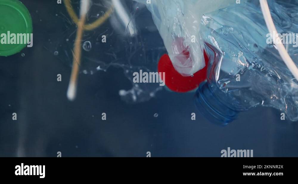 close up plastic waste floating in the water. Environmental hazard