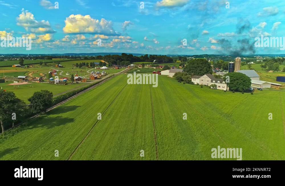 An Aerial View of Amish Farm lands With a Single Rail Road Track on a ...