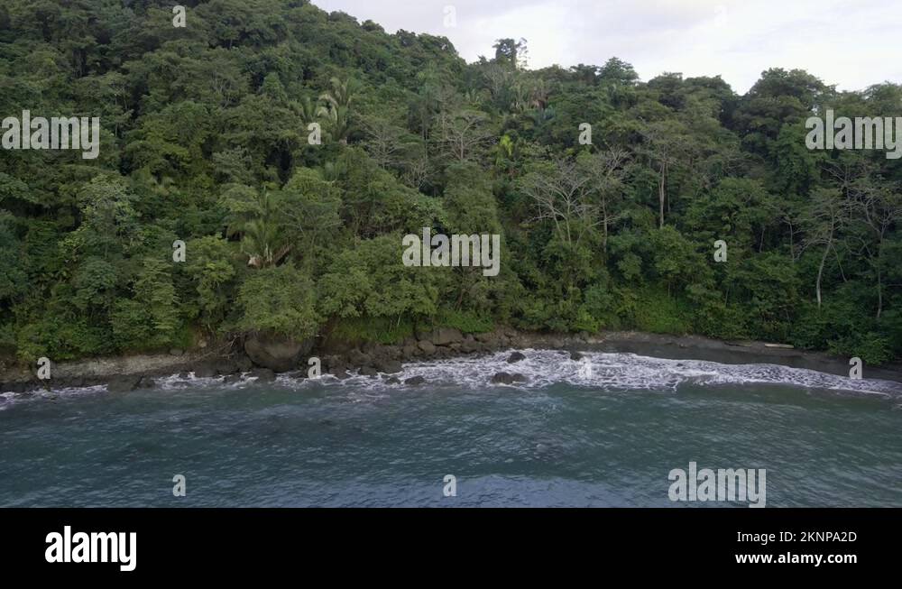 The secluded playa la Macha near Quepos, Costa Rica at high tide. Aerial Stock Video Footage Alamy