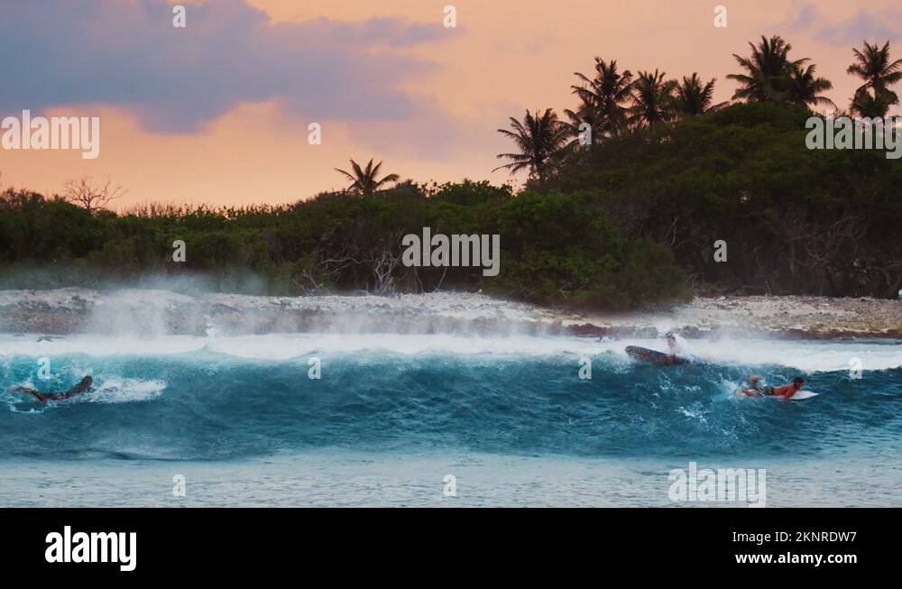 Back view of the ocean wave breaking on the shore in Maldives and ...