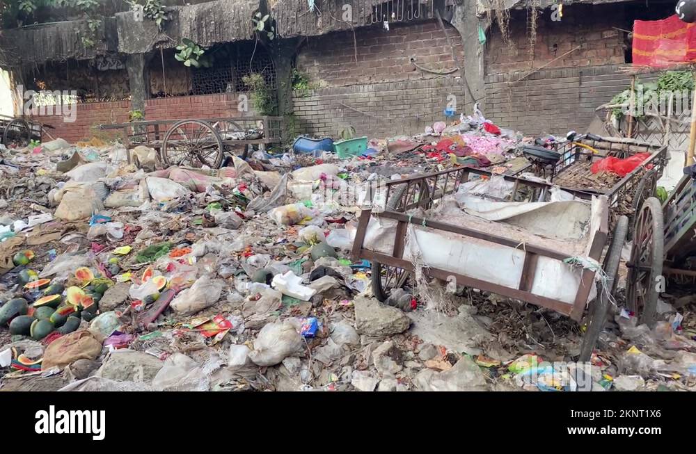 Strewn Rubbish With Carts On Top On Side Of Road In Dhaka, Bangladesh