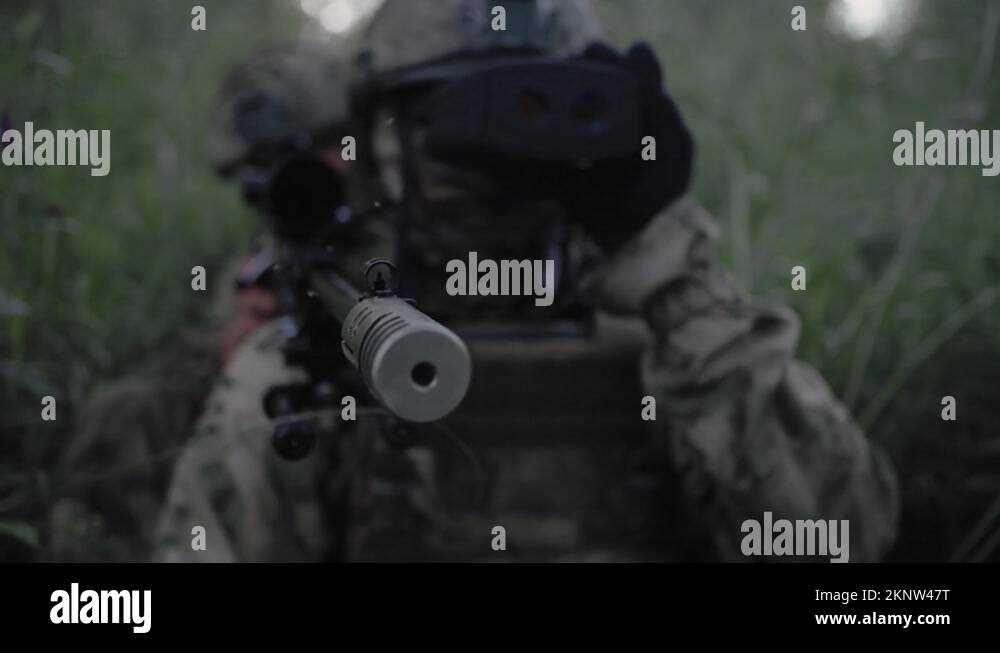 Soldiers with sniper rifle, sniper rangefinder on military operation in